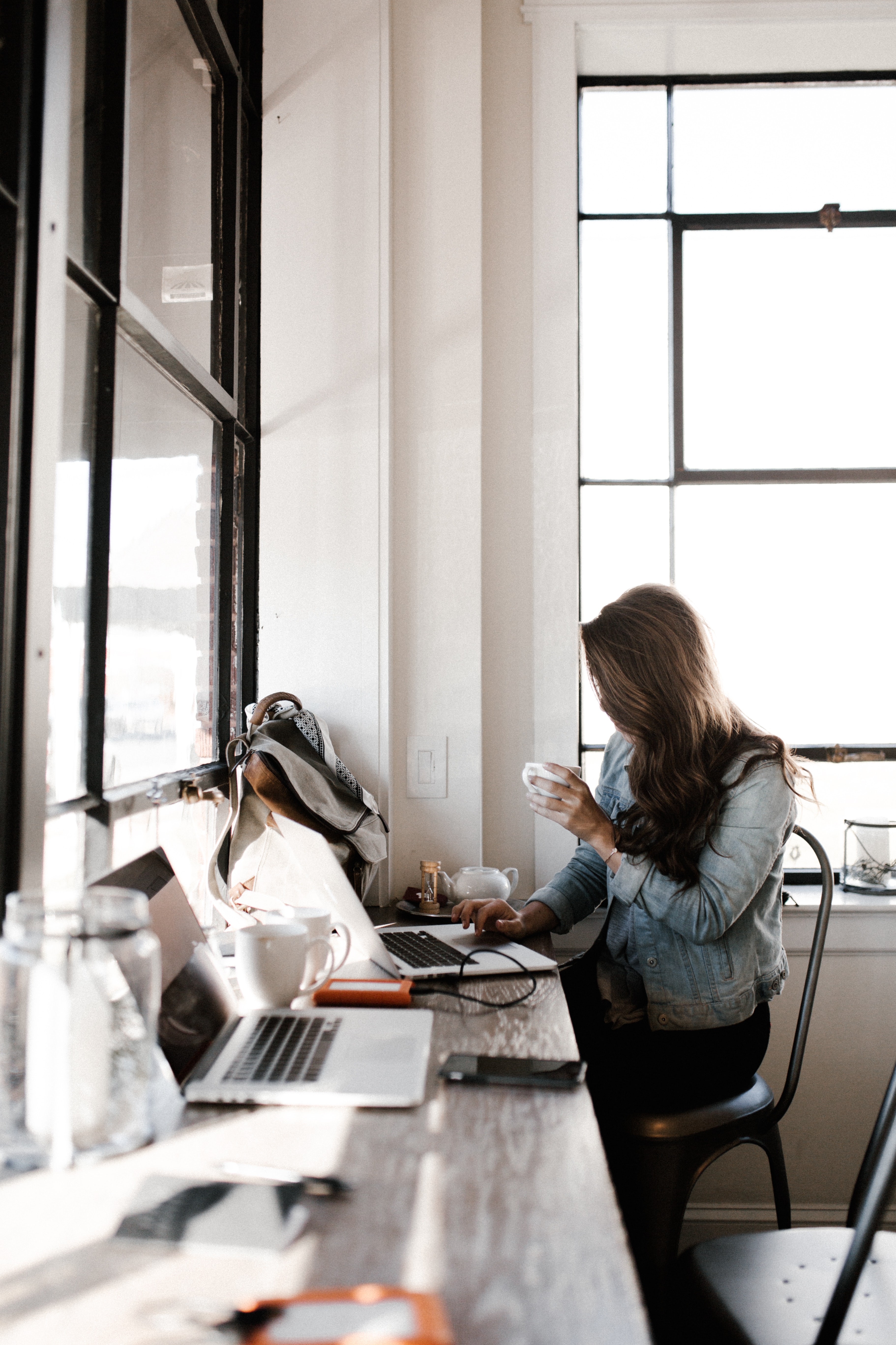 a woman looks laptop